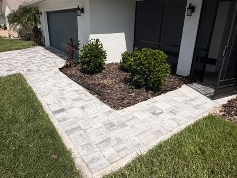 Gray paver walkway installed by Bright Sheep along a Fort Myers home